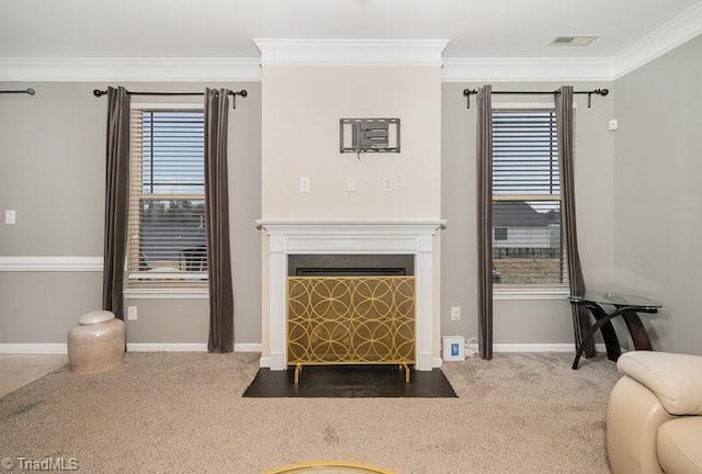 living room featuring ornamental molding and carpet floors