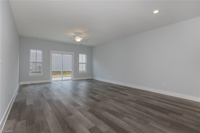 206 Cason Dr, Gibsonville, NC 27249 - spare room with dark wood-type flooring, baseboards, a ceiling fan, and recessed lighting