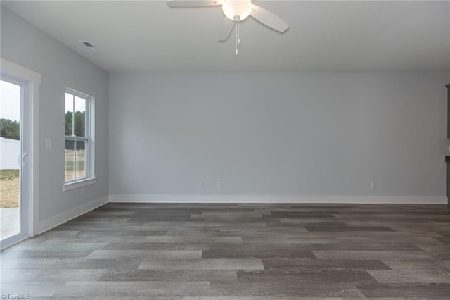 206 Cason Dr, Gibsonville, NC 27249 - empty room with plenty of natural light, a ceiling fan, wood finished floors, and baseboards