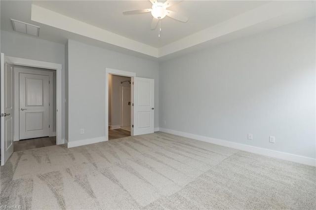 206 Cason Dr, Gibsonville, NC 27249 - unfurnished bedroom with carpet flooring, baseboards, a raised ceiling, and ceiling fan