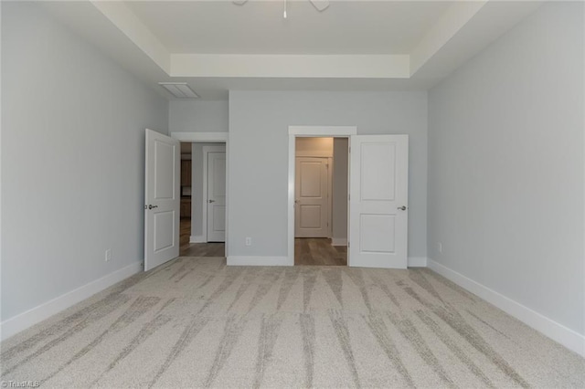 206 Cason Dr, Gibsonville, NC 27249 - unfurnished bedroom featuring a raised ceiling, carpet, and baseboards