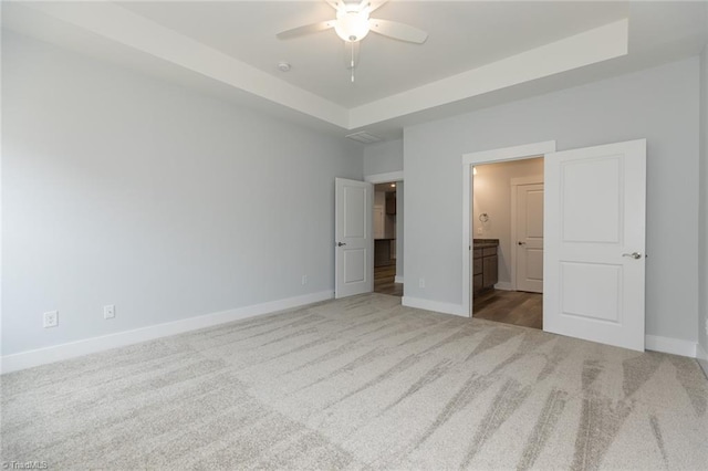 206 Cason Dr, Gibsonville, NC 27249 - unfurnished bedroom with carpet floors, baseboards, and a tray ceiling