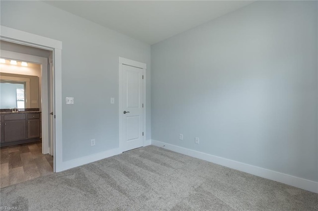 206 Cason Dr, Gibsonville, NC 27249 - unfurnished bedroom with carpet flooring and baseboards