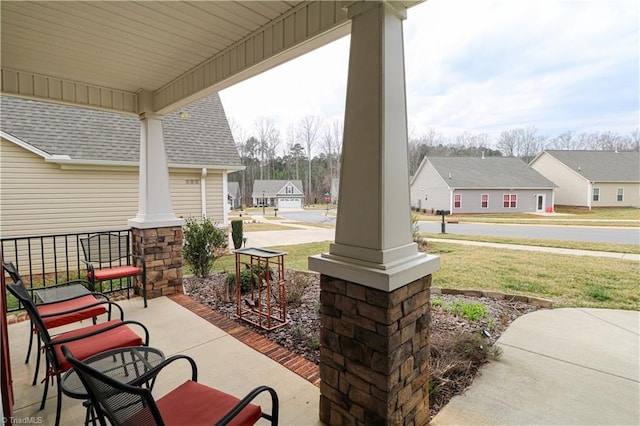 view of patio / terrace featuring a porch and a residential view