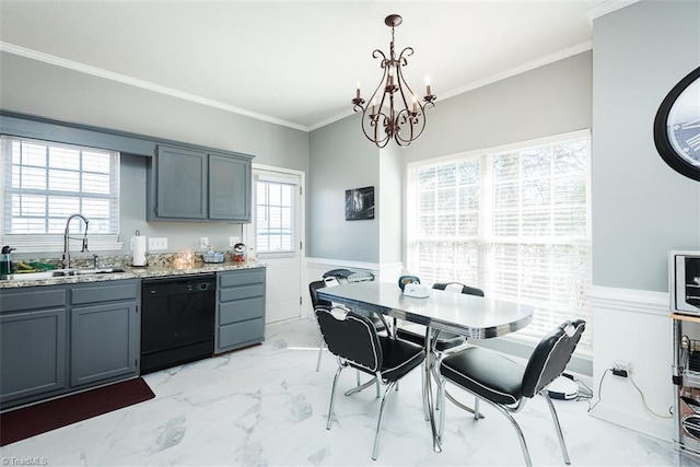 kitchen featuring black dishwasher, decorative light fixtures, marble finish floor, wainscoting, and a sink