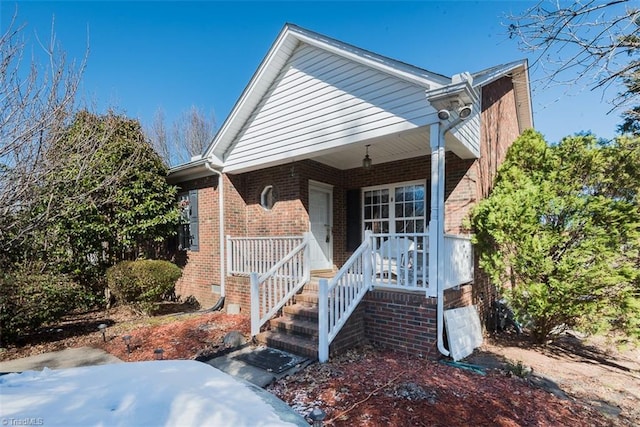 view of front of home with brick siding