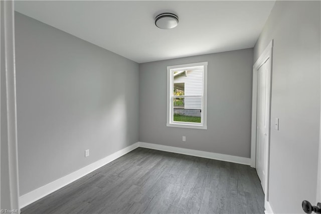 300 Center St, Thomasville, NC 27360 - unfurnished bedroom featuring dark wood-style floors and baseboards