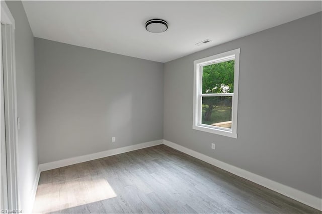 300 Center St, Thomasville, NC 27360 - spare room featuring wood finished floors and baseboards