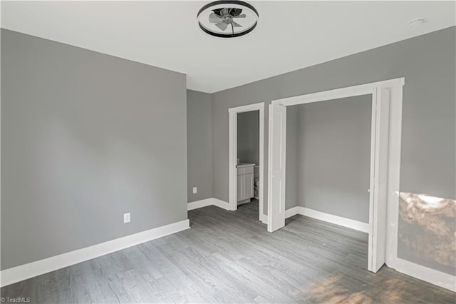 300 Center St, Thomasville, NC 27360 - unfurnished bedroom featuring wood finished floors and baseboards