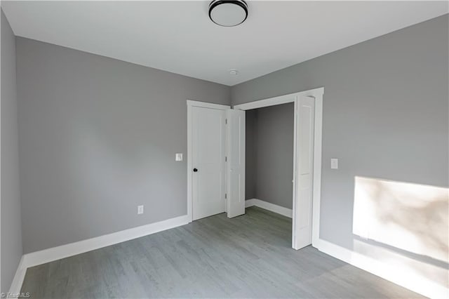 300 Center St, Thomasville, NC 27360 - unfurnished bedroom featuring wood finished floors and baseboards