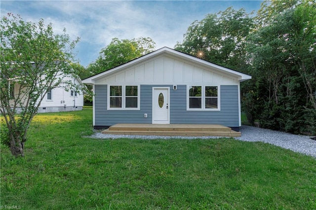 300 Center St, Thomasville, NC 27360 - bungalow with board and batten siding, a front lawn, a deck, and driveway