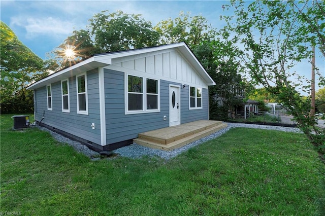 300 Center St, Thomasville, NC 27360 - view of home's exterior with board and batten siding, central AC, and a lawn