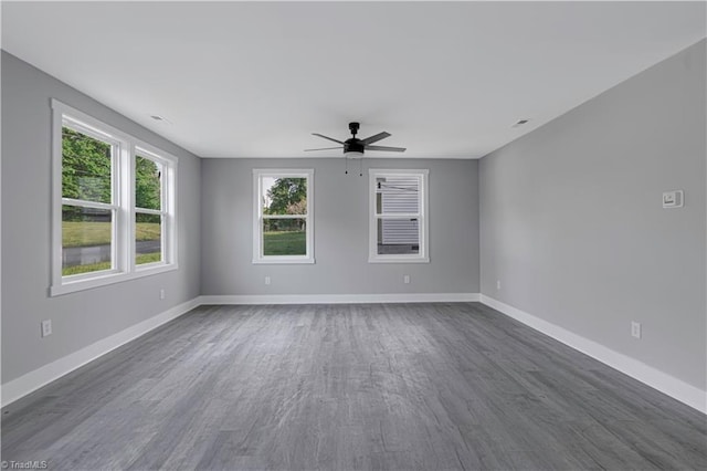 300 Center St, Thomasville, NC 27360 - spare room featuring a ceiling fan, baseboards, and dark wood-style flooring