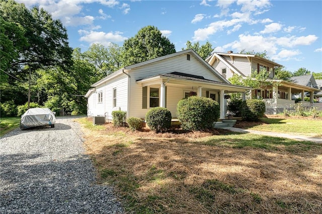 304 Louise Ave, High Point, NC 27262 - view of front facade with a porch, cooling unit, driveway, and a front lawn