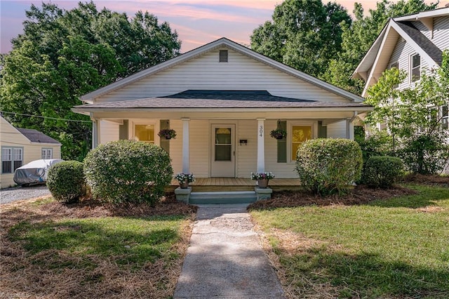 304 Louise Ave, High Point, NC 27262 - bungalow with covered porch and a front lawn