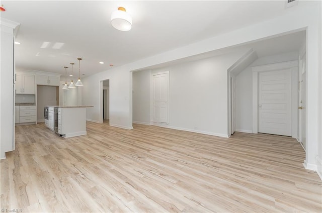 304 Louise Ave, High Point, NC 27262 - unfurnished living room featuring light wood-type flooring, recessed lighting, baseboards, and wine cooler