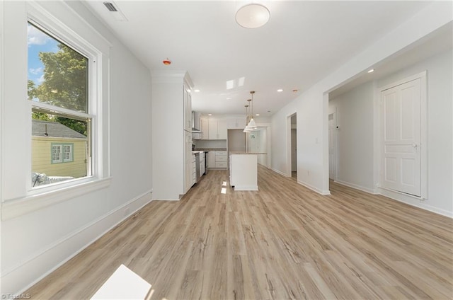 304 Louise Ave, High Point, NC 27262 - unfurnished living room featuring healthy amount of natural light, light wood finished floors, baseboards, and recessed lighting