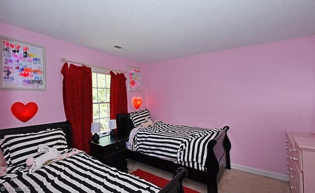 5467 Moravian Heights Ln, Clemmons, NC 27012 - carpeted bedroom with a textured ceiling and baseboards