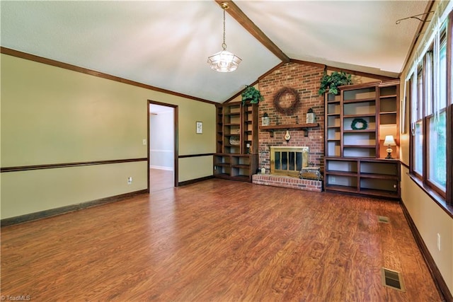 1625 Eagle Crest Dr, Pfafftown, NC 27040 - unfurnished living room with wood finished floors, baseboards, a brick fireplace, and a chandelier
