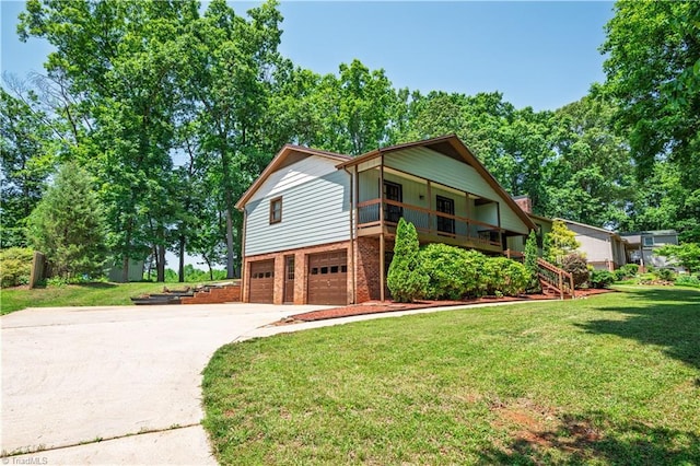 1625 Eagle Crest Dr, Pfafftown, NC 27040 - view of front of property featuring brick siding, an attached garage, concrete driveway, a front lawn, and stairs