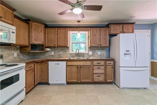 1625 Eagle Crest Dr, Pfafftown, NC 27040 - kitchen featuring white appliances, a sink, brown cabinets, a textured ceiling, and crown molding