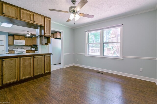 1625 Eagle Crest Dr, Pfafftown, NC 27040 - kitchen with white appliances, a ceiling fan, brown cabinets, dark wood-type flooring, and crown molding