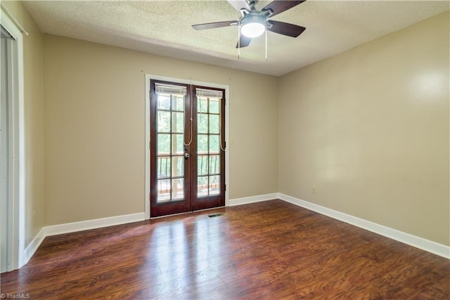1625 Eagle Crest Dr, Pfafftown, NC 27040 - empty room featuring french doors, dark wood finished floors, a ceiling fan, baseboards, and a textured ceiling