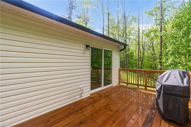 wooden terrace featuring grilling area