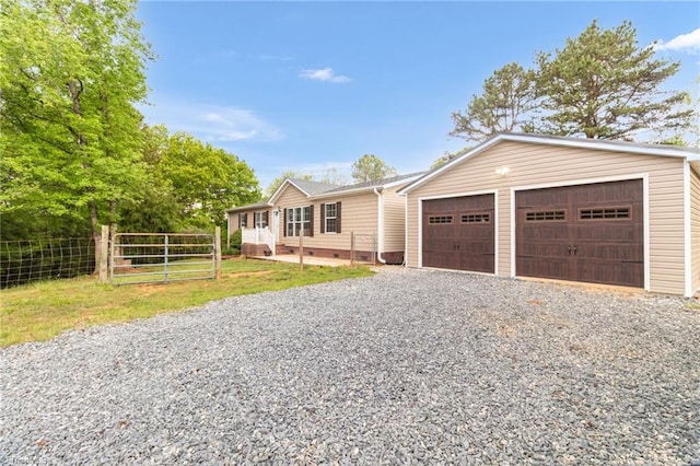 ranch-style home featuring fence