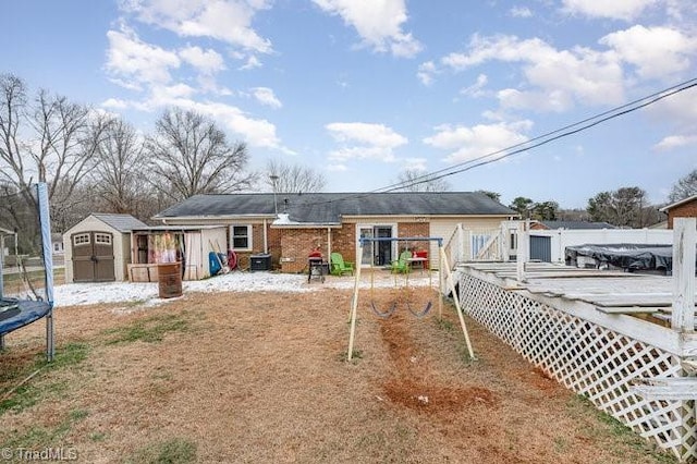 exterior space featuring a wooden deck and a shed