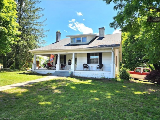 bungalow-style home featuring a chimney, a front yard, and a porch