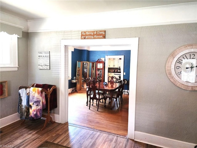 dining room with wood finished floors and baseboards