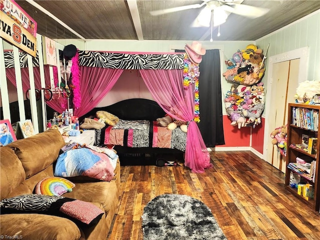 bedroom with wood finished floors and a ceiling fan