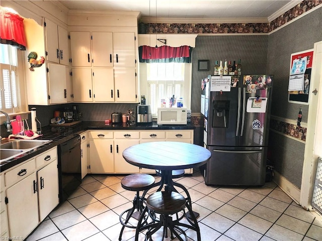 kitchen with refrigerator with ice dispenser, black dishwasher, white microwave, a sink, and ornamental molding