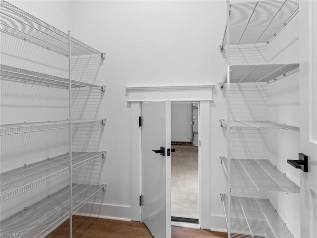 pantry with hardwood / wood-style floors