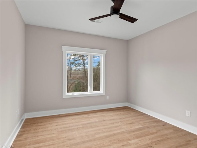 unfurnished room with ceiling fan and light hardwood / wood-style flooring