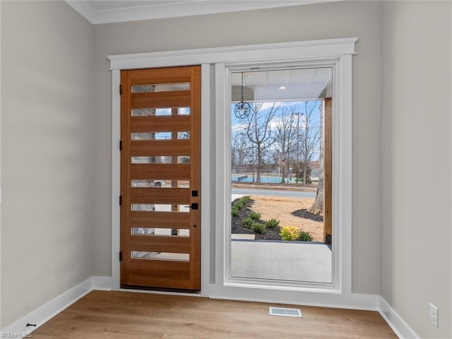 doorway with light hardwood / wood-style floors