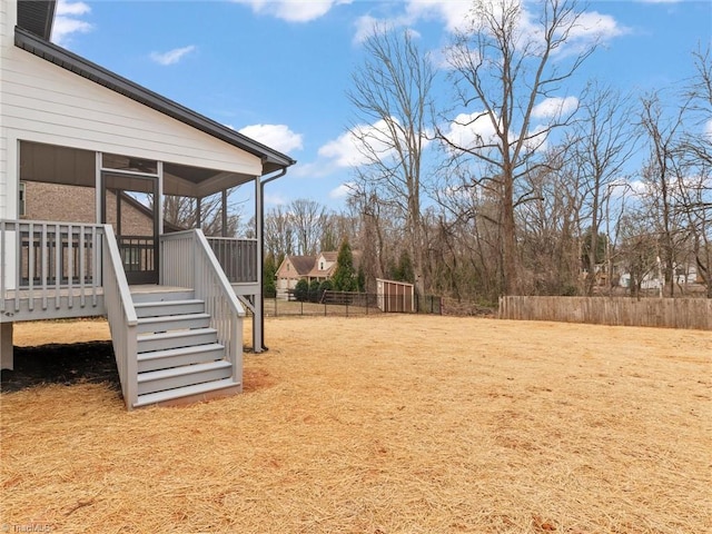 view of yard with a sunroom