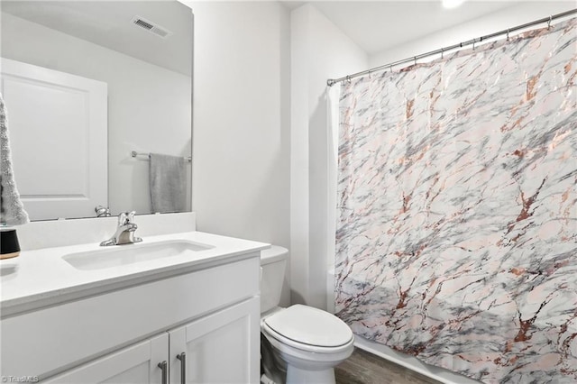 4514 Heatherly Rd, Winston-Salem, NC 27105 - full bathroom featuring vanity and wood finished floors