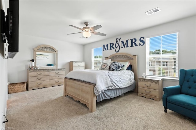 4514 Heatherly Rd, Winston-Salem, NC 27105 - bedroom with light colored carpet and ceiling fan