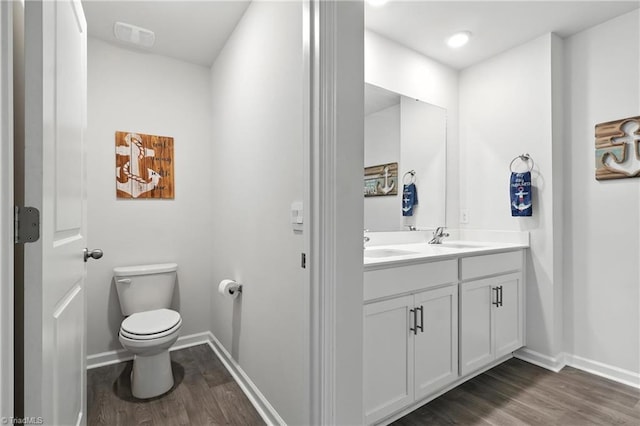 4514 Heatherly Rd, Winston-Salem, NC 27105 - full bath featuring wood finished floors and double vanity