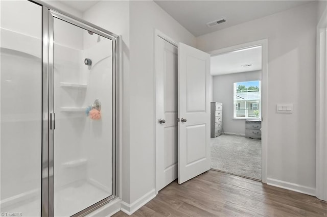 4514 Heatherly Rd, Winston-Salem, NC 27105 - full bath with a stall shower and wood finished floors