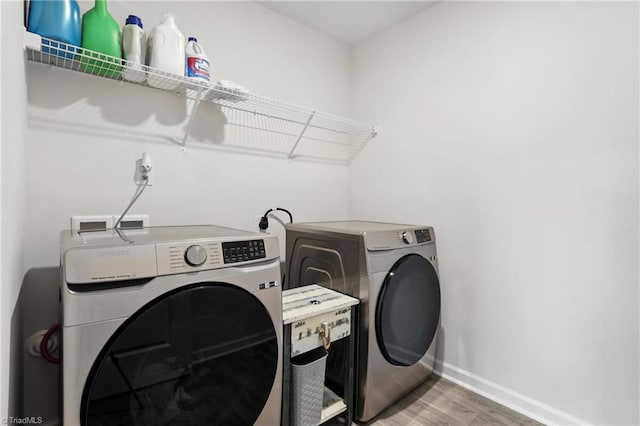 4514 Heatherly Rd, Winston-Salem, NC 27105 - laundry area with washer and dryer and wood finished floors