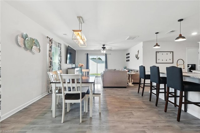 4514 Heatherly Rd, Winston-Salem, NC 27105 - dining room featuring ceiling fan and wood finished floors