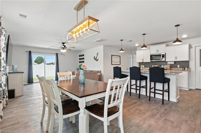 4514 Heatherly Rd, Winston-Salem, NC 27105 - dining space with ceiling fan, light wood-type flooring, and recessed lighting
