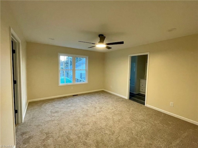 319 E 3rd Ave Extension, Lexington, NC 27292 - unfurnished bedroom featuring carpet, ensuite bathroom, and a ceiling fan