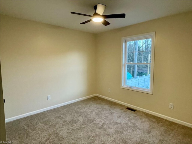 319 E 3rd Ave Extension, Lexington, NC 27292 - carpeted empty room with baseboards and ceiling fan