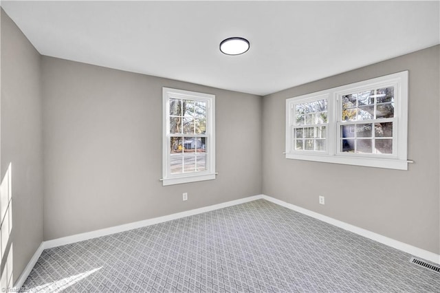 empty room featuring carpet floors