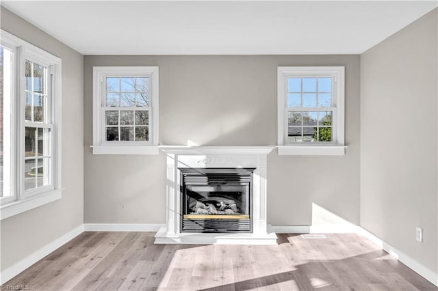 unfurnished living room with light hardwood / wood-style floors