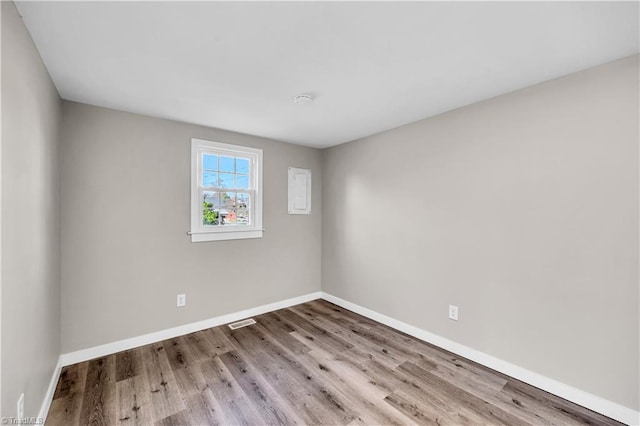 spare room featuring light wood-type flooring